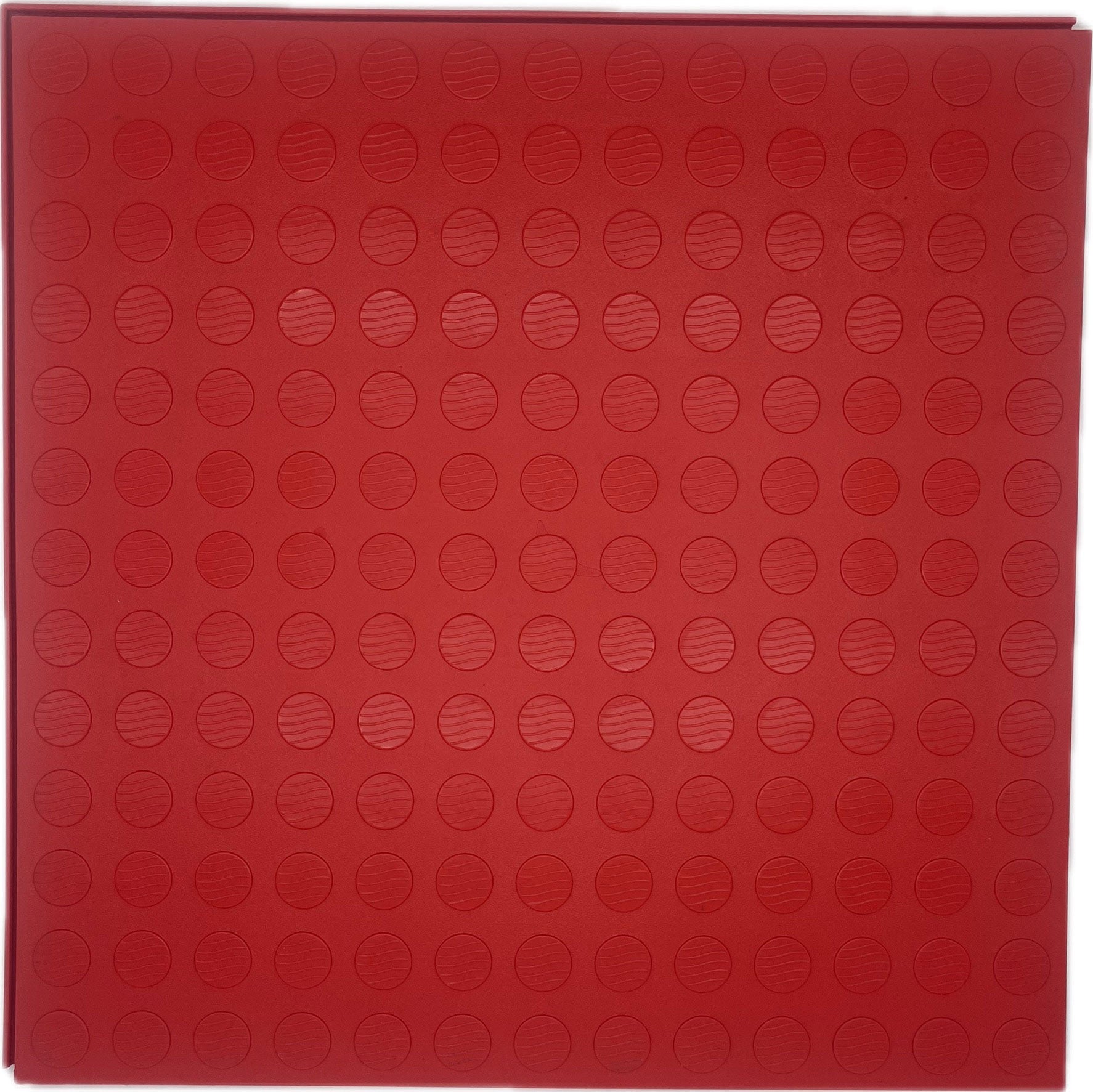A square red garage floor mat with an embossed circular dot pattern, shown flat against a white background.